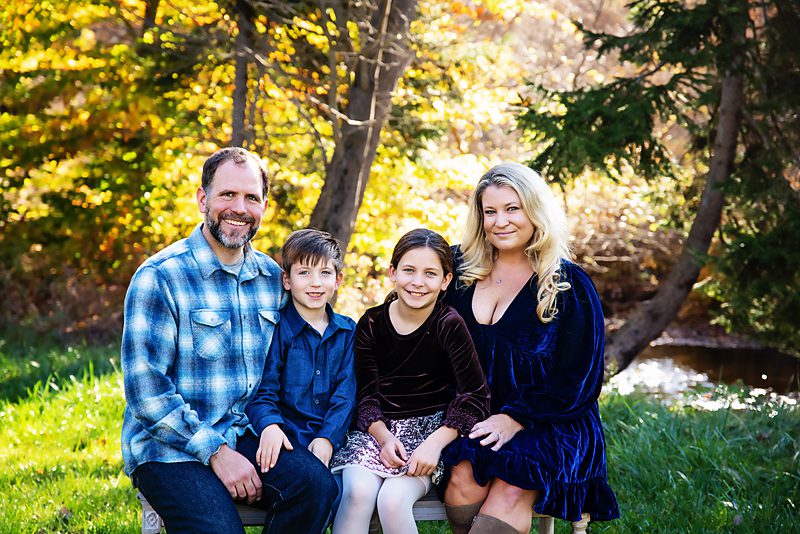 Family dressed in blues and browns on an early fall day in Jefferson