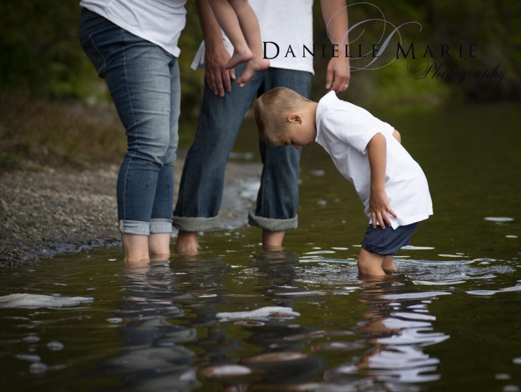 Letting boys be boys.  Exploring Saffins pond during a family photo shoot. 